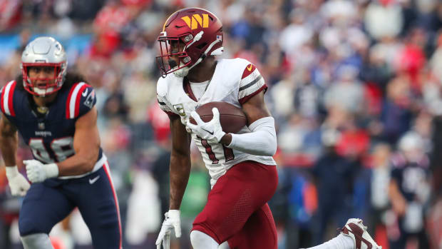 Washington Commanders receiver Terry McLaurin (17) runs the ball during the second half against the New England Patriots at Gillette Stadium.